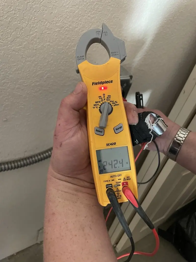Voltage testing with clamp meter during Electrical Installation Services in Spurgeon